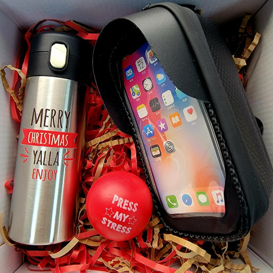 Gift set with a thermos, phone case, and stress ball in a box.